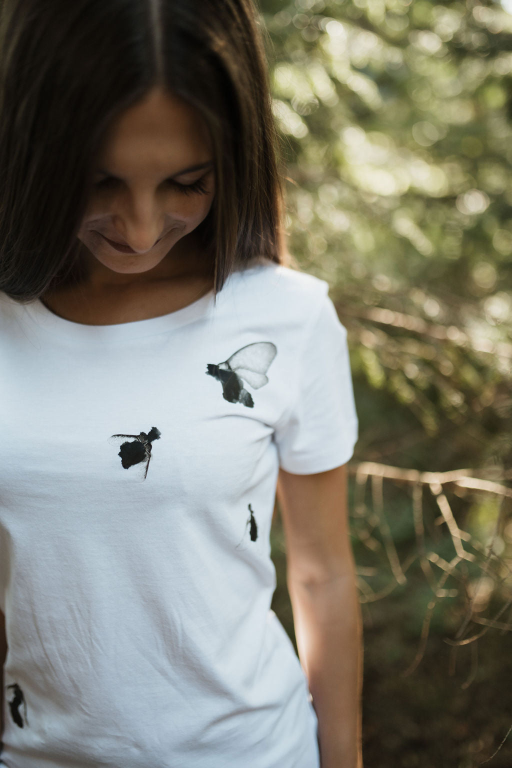 White shirt with flying bugs