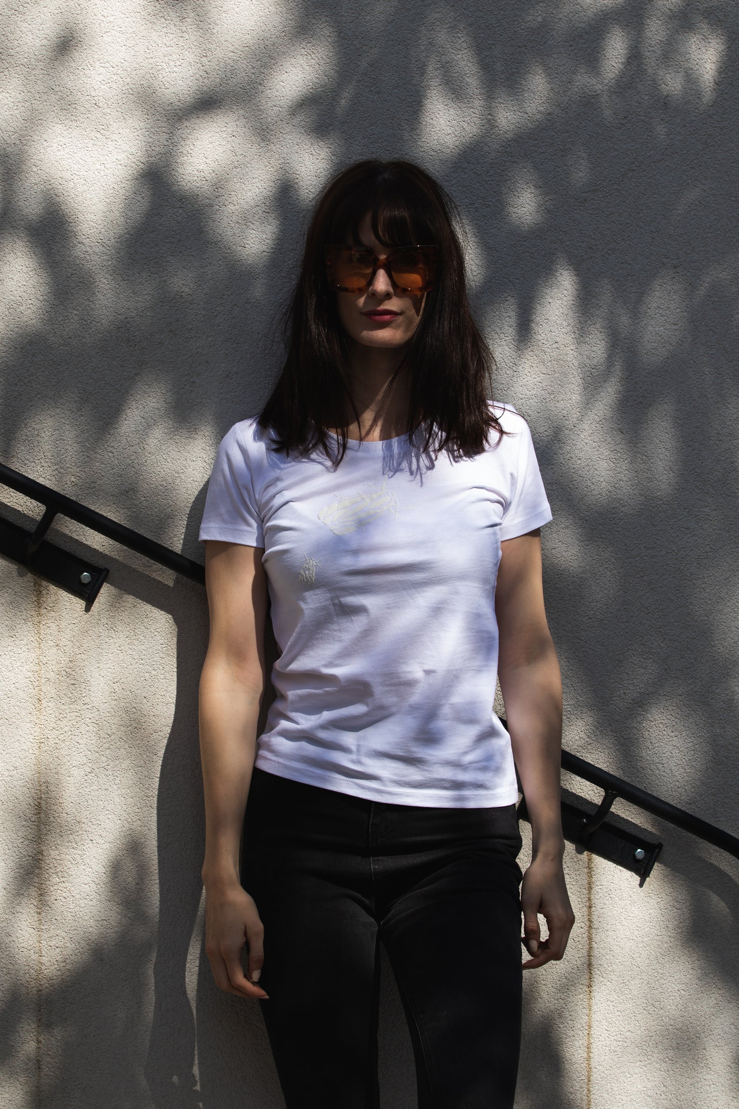 White T shirt and two small 3D bugs