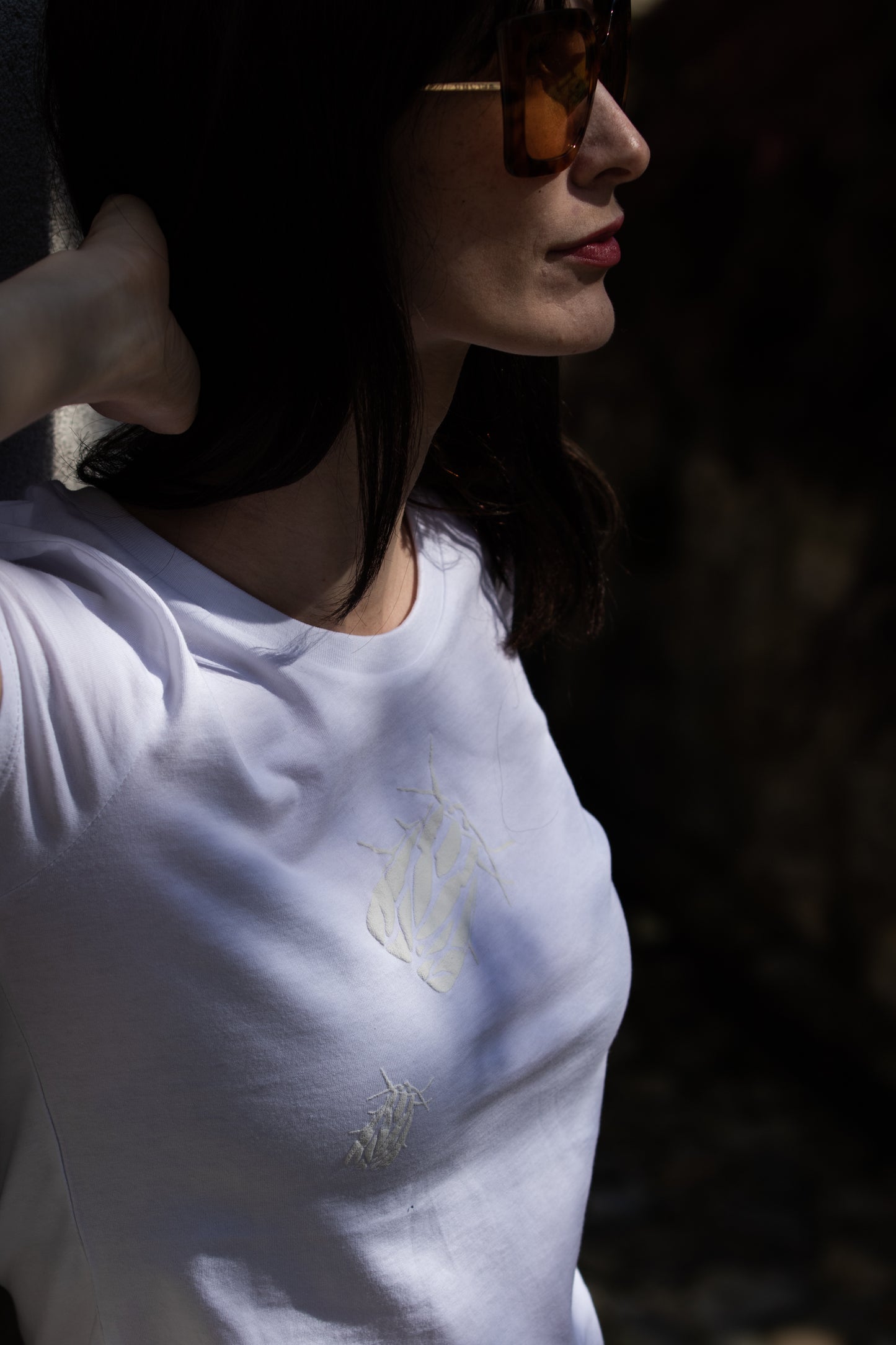 White T shirt and two small 3D bugs
