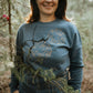 The iconic crew neck sweater with copper bubbles with a bug