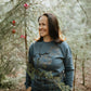 The iconic crew neck sweater with copper bubbles with a bug