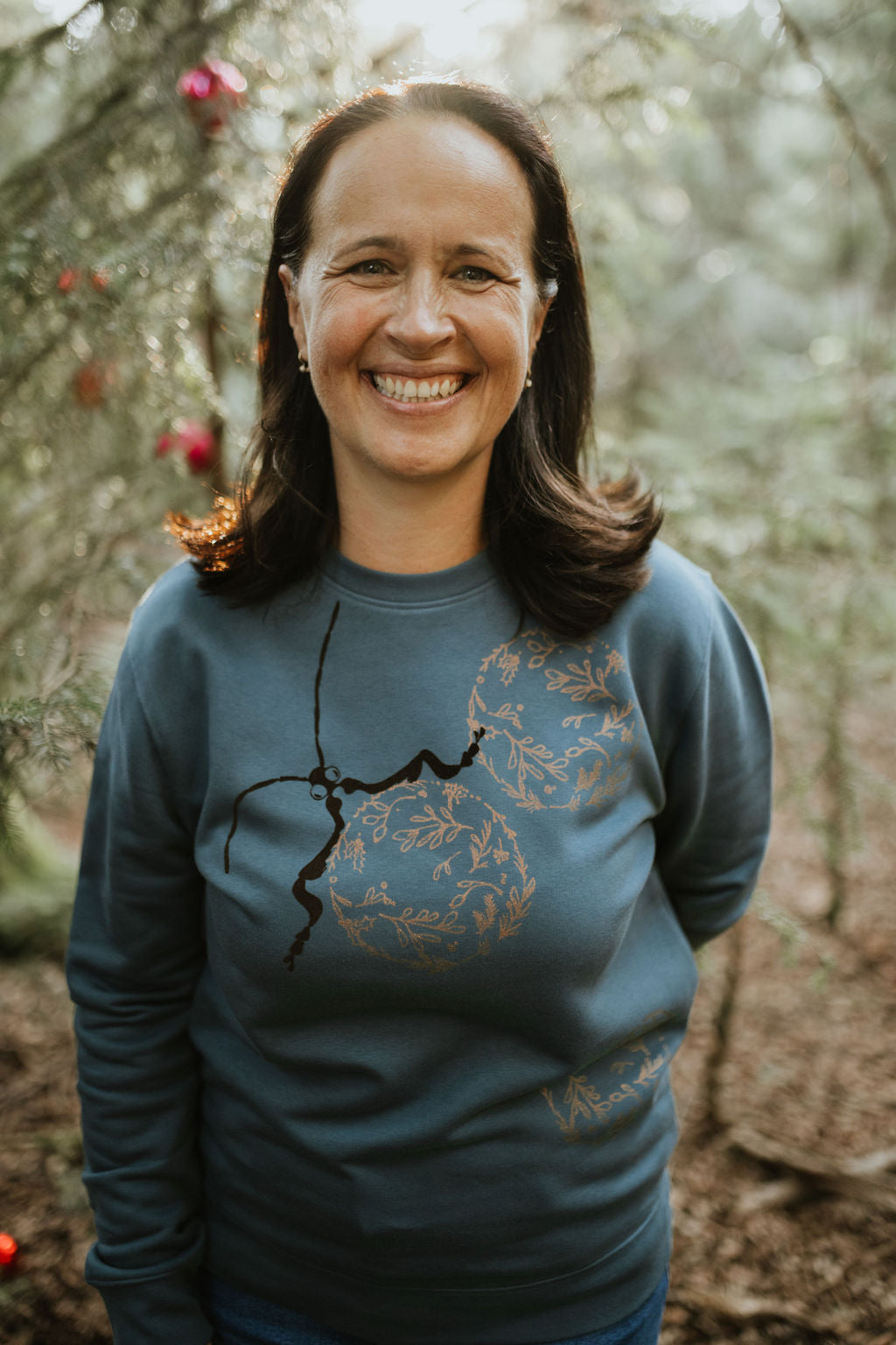 The iconic crew neck sweater with copper bubbles with a bug