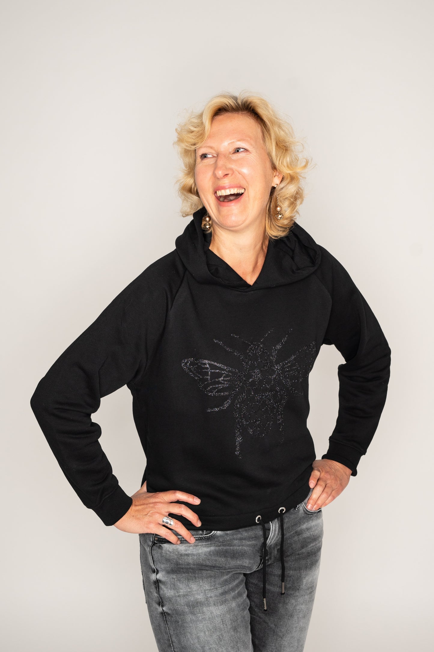 The women's cropped hoodie with a glitter Bee on the front
