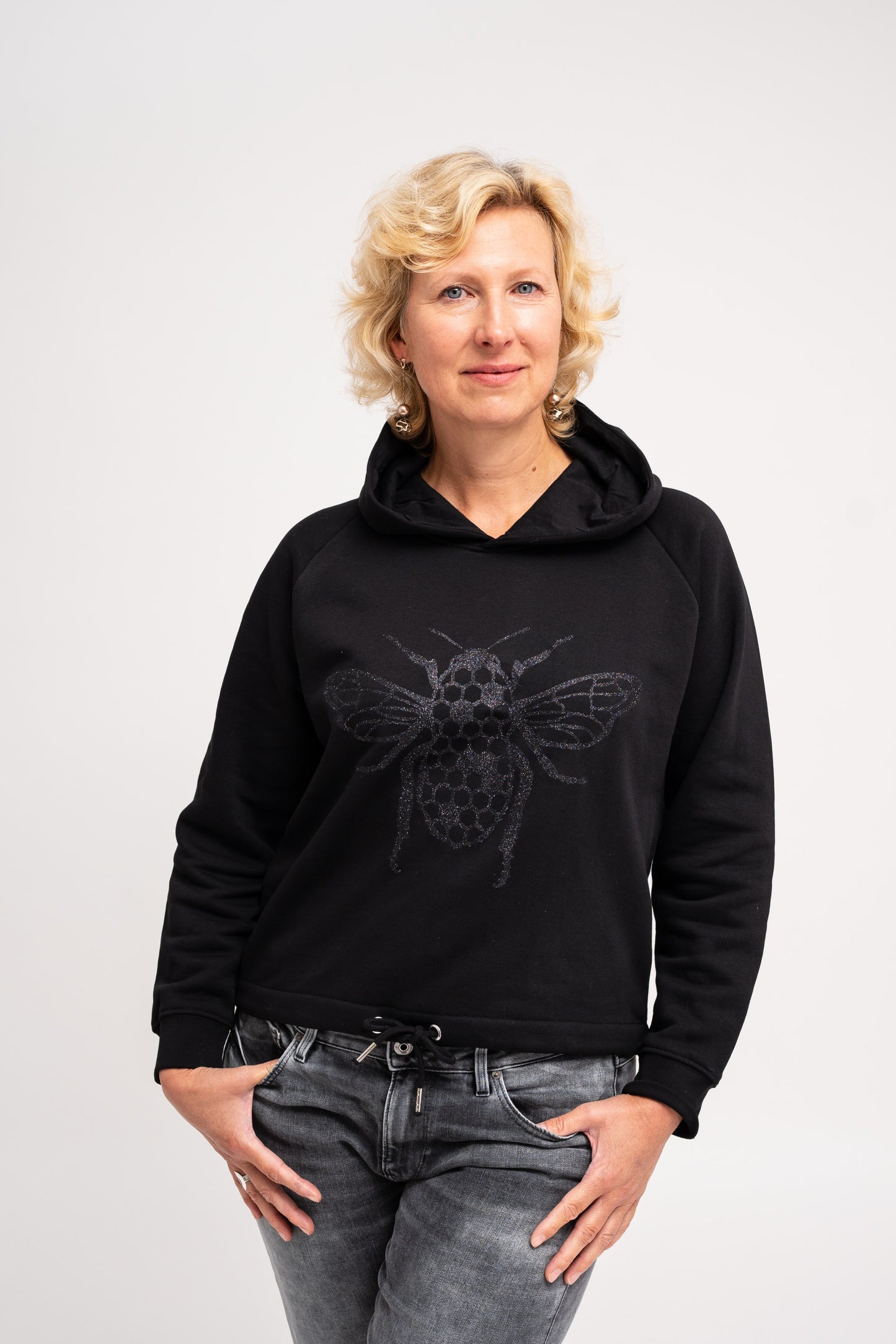 The women's cropped hoodie with a glitter Bee on the front