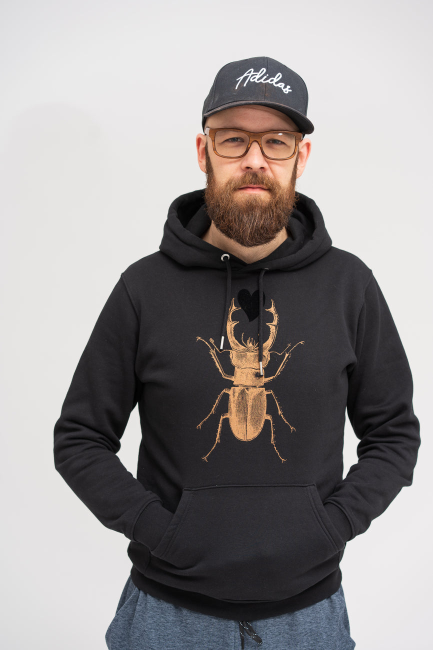 Iconic unisex black hoodie with bronze scarab and black heart