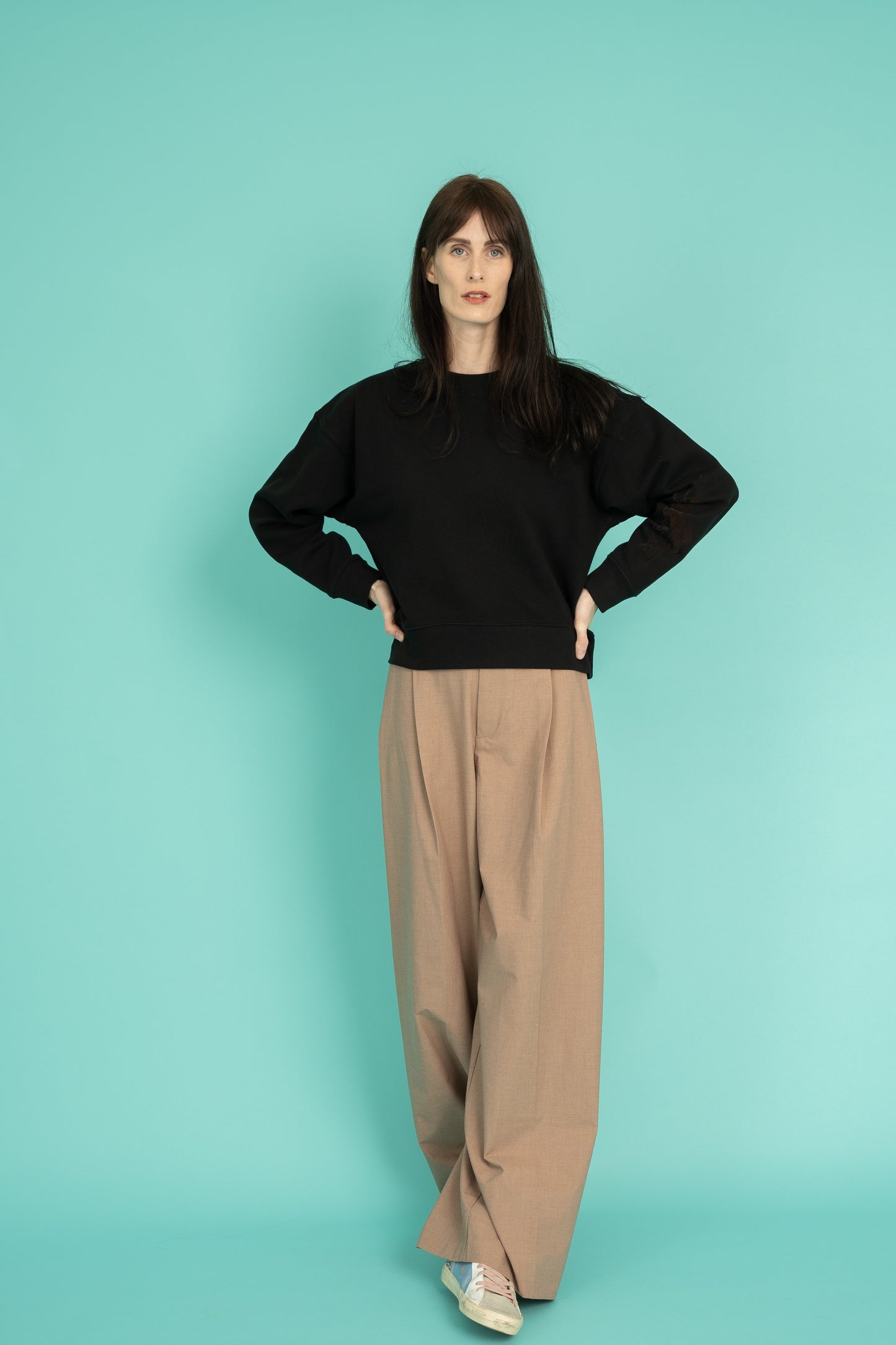 Black cropped crew neck sweatshirt with a grasshopper on the sleeve