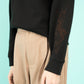 Black cropped crew neck sweatshirt with a grasshopper on the sleeve