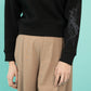 Kratek črn pulover s kobilico v rjavi ali sivi barvi  na roki
