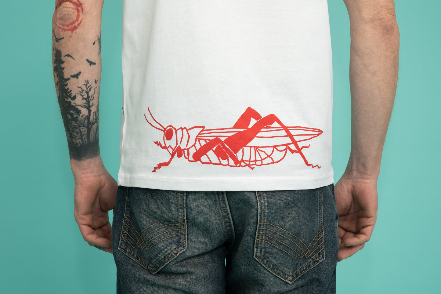 Mens tee with a blue and red grasshopper