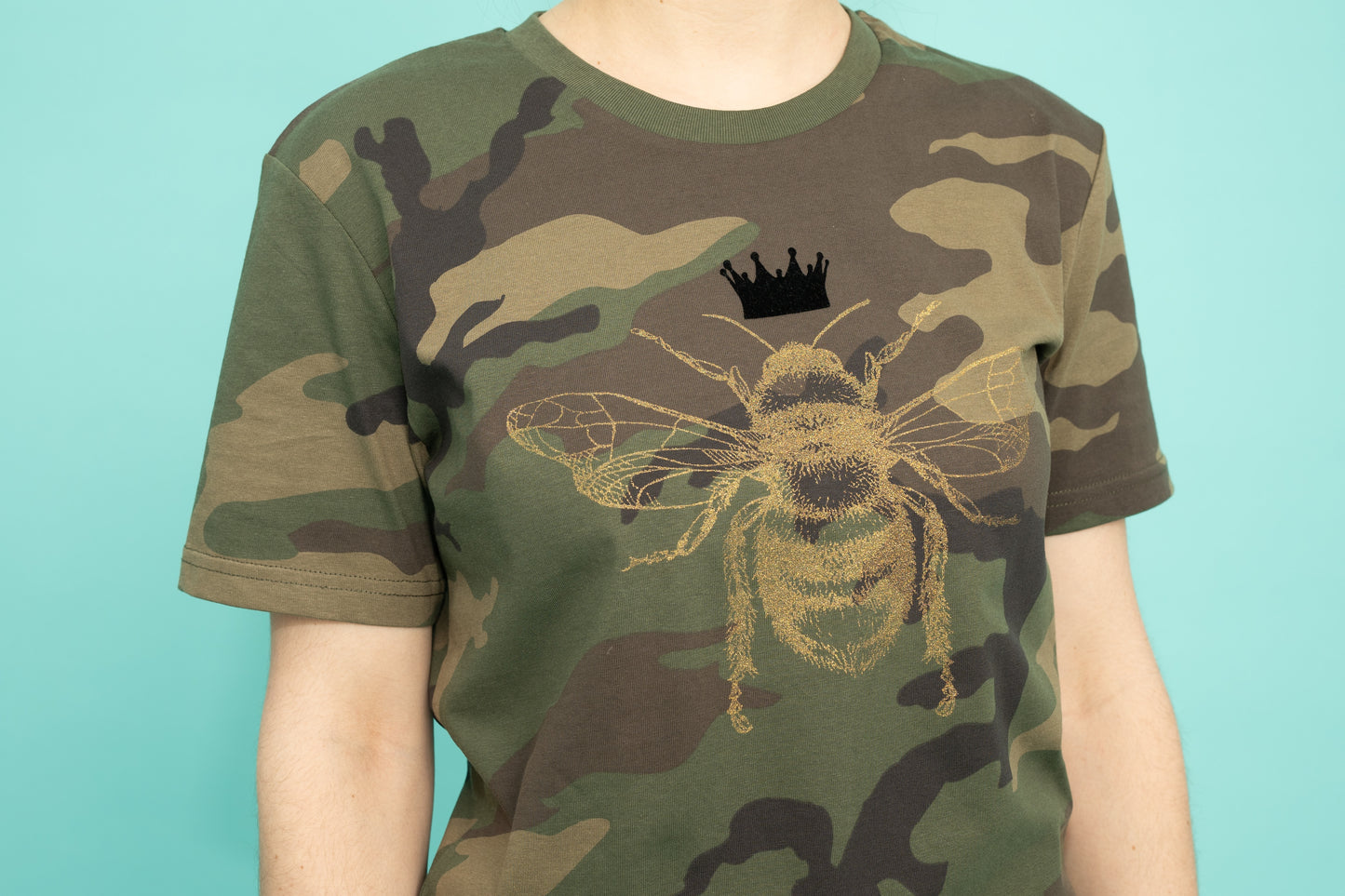 Golden bee on a military pattern tee