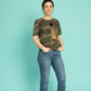 Golden scarab with black plush heart on a military pattern tee