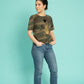 Golden scarab with black plush heart on a military pattern tee
