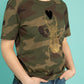 Golden scarab with black plush heart on a military pattern tee