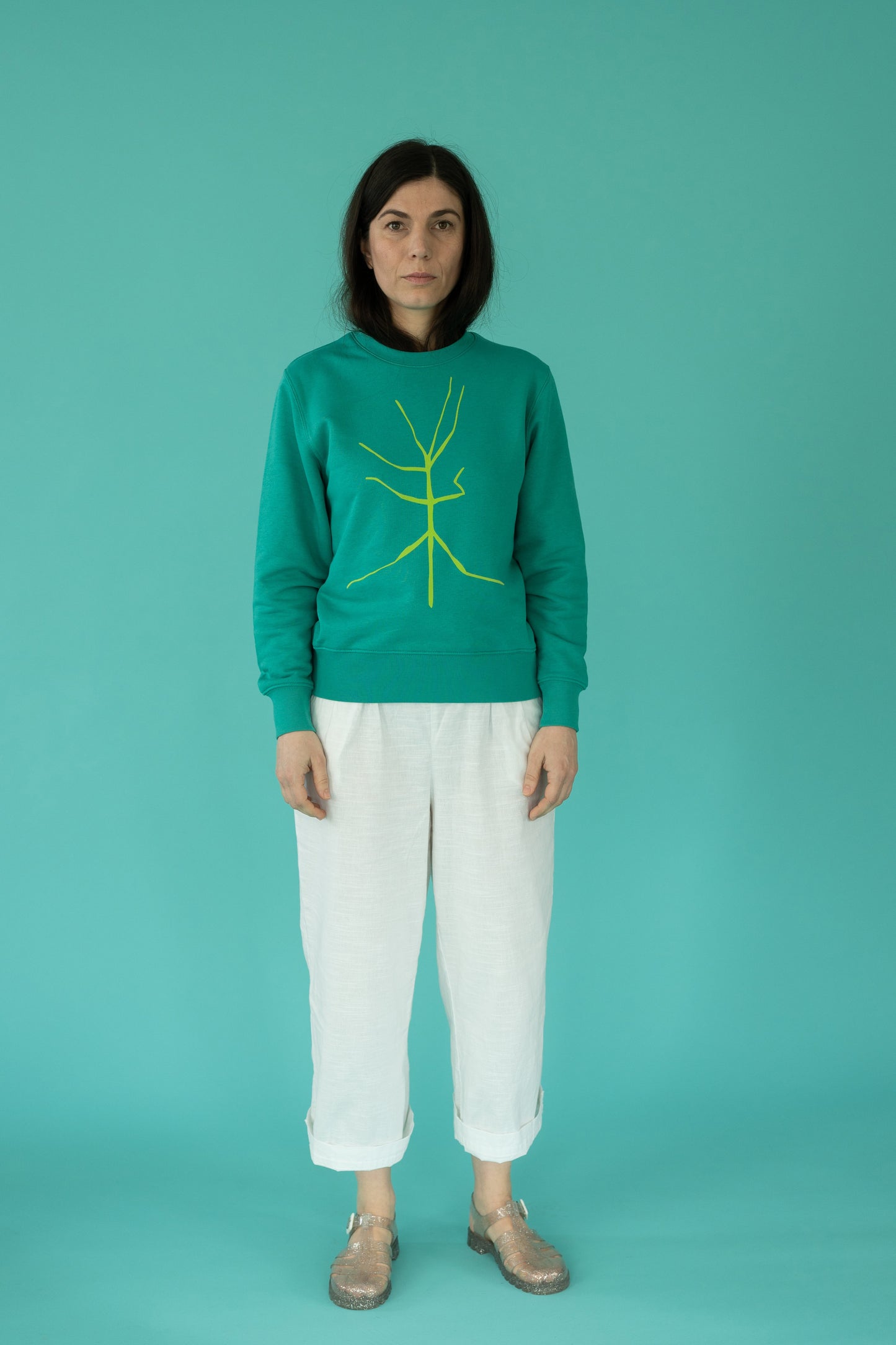 Turquoise sweater and walking stick