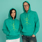 Turquoise hoodie and a walking stick in front