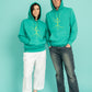 Turquoise hoodie and a walking stick in front