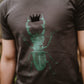 Men's gray T-shirt with green scarab holding a black crown 