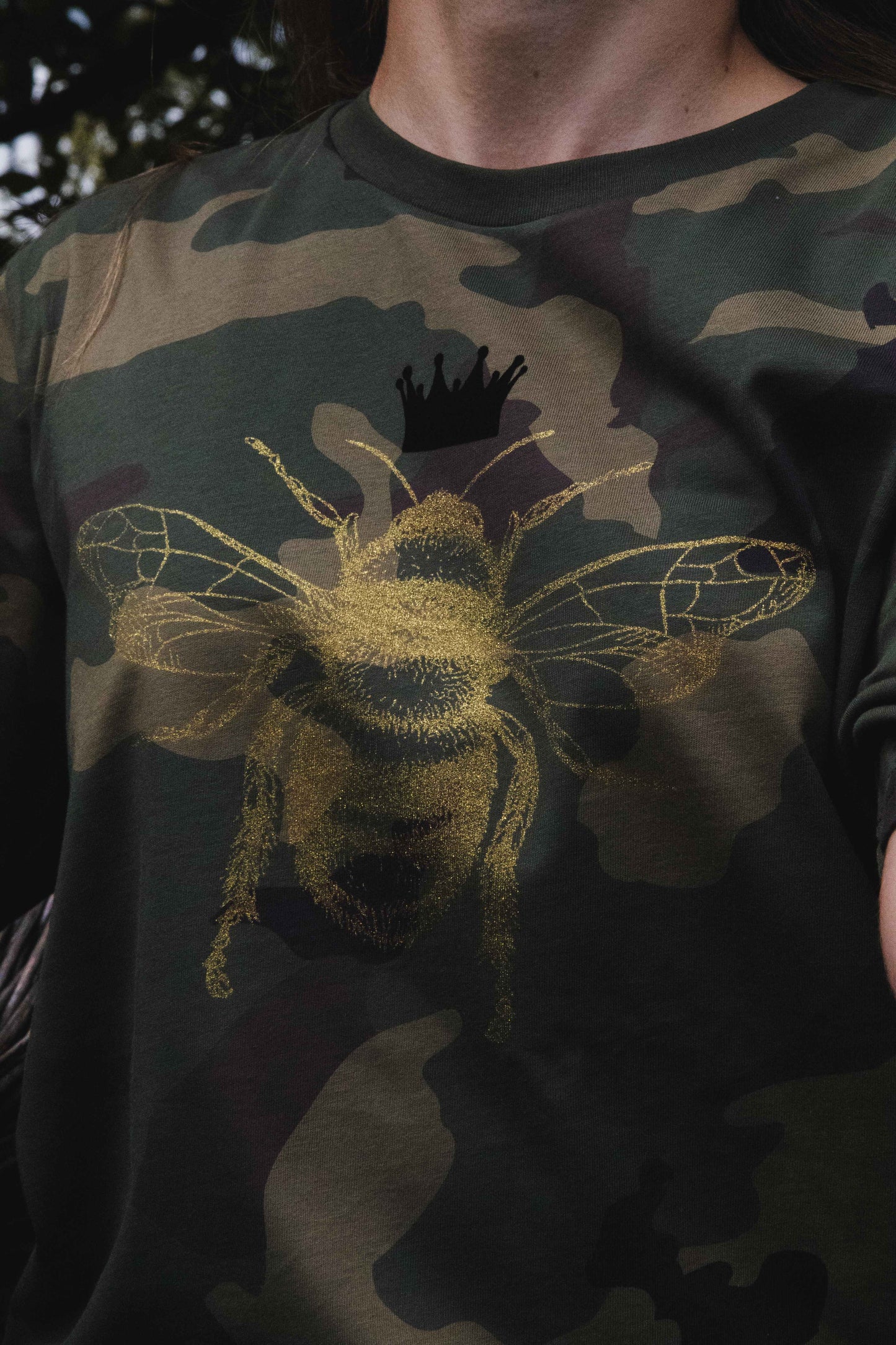 Golden bee on a military pattern tee