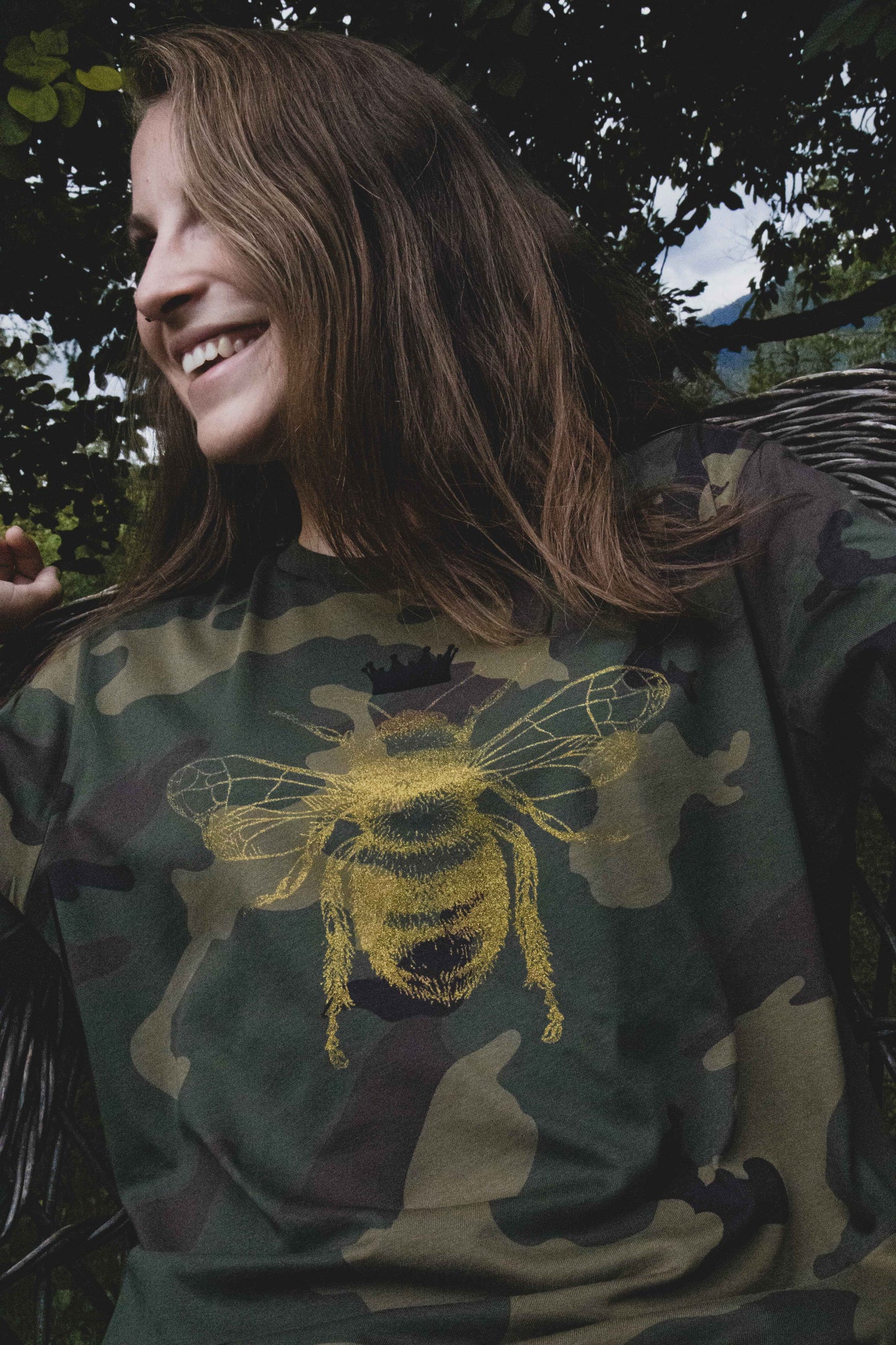 Golden bee on a military pattern tee