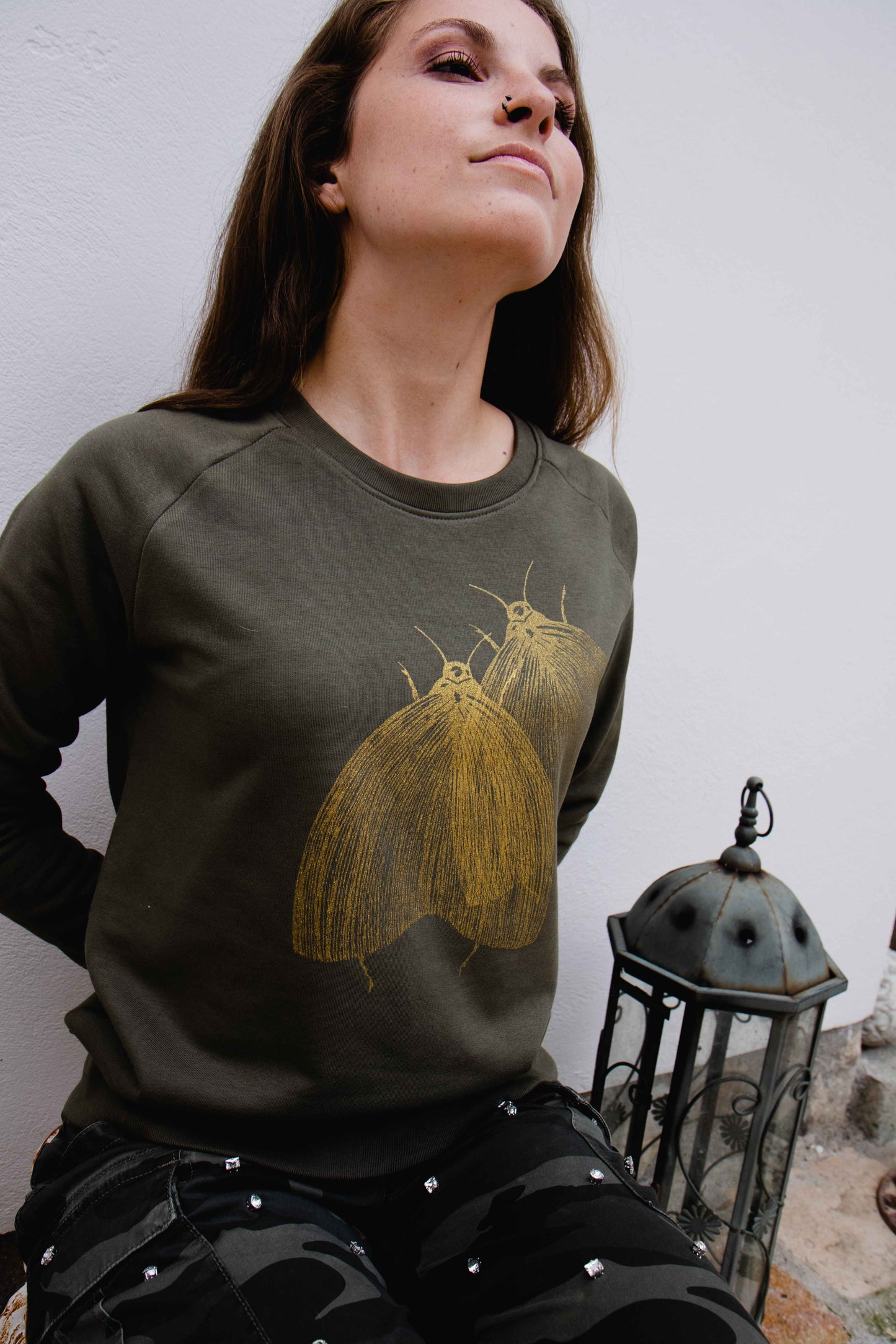 Olive green sweater with golden moths 