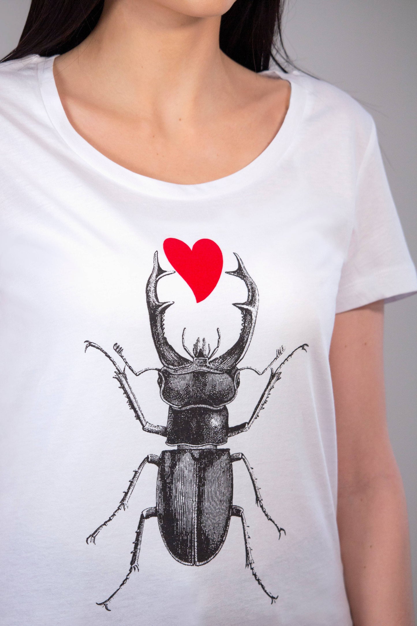 Scarab with a red plush heart women's tee