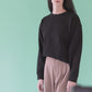 Black cropped crew neck sweatshirt with a grasshopper on the sleeve